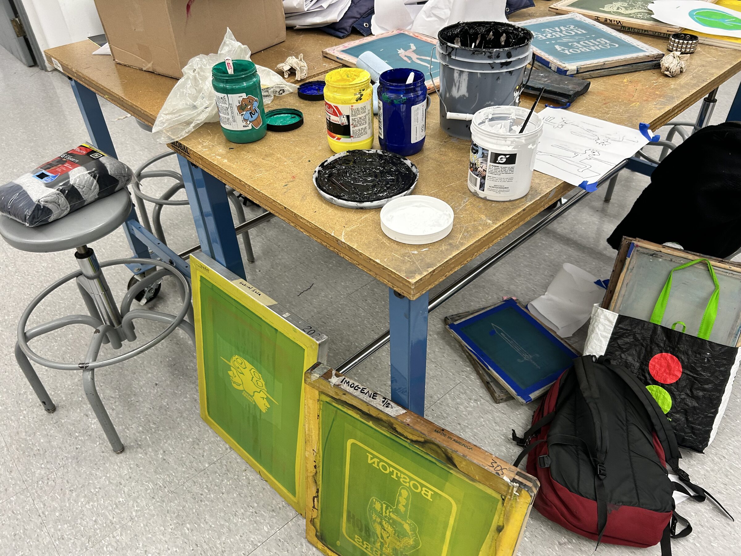 Screens, ink, and tools prepared for a workshop