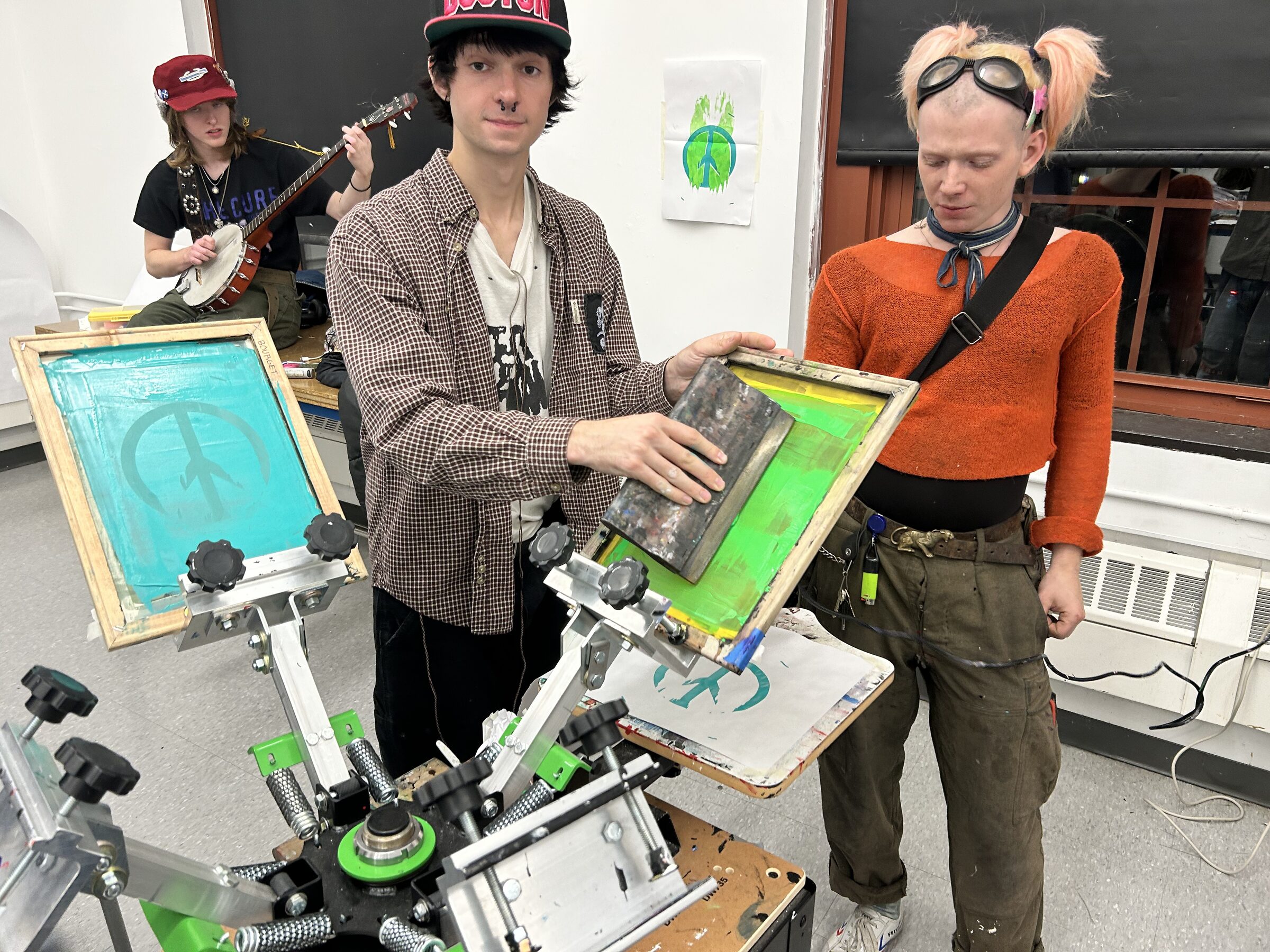 Garment Printing Club members holding screens