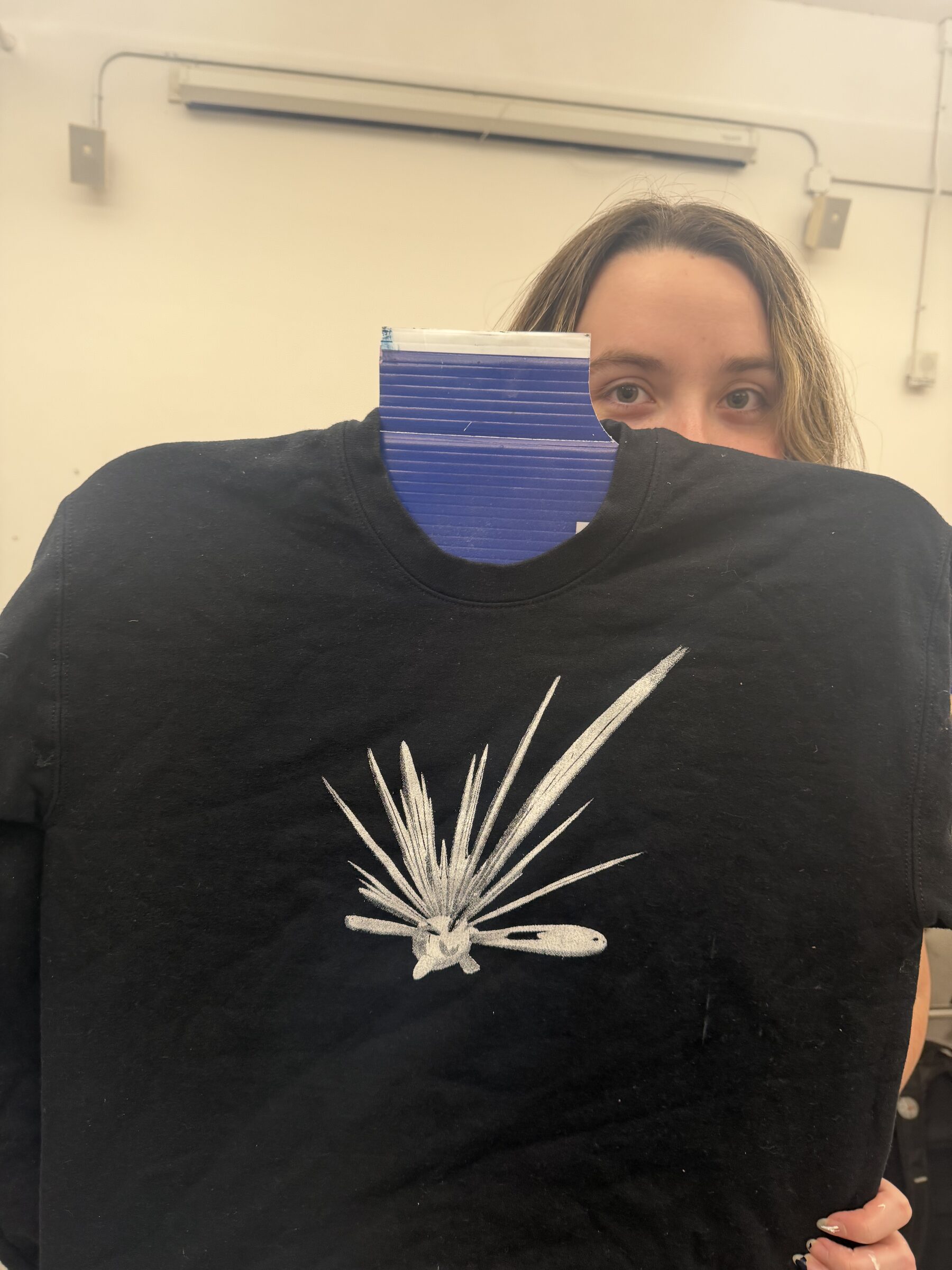 Club member showing a printed shirt