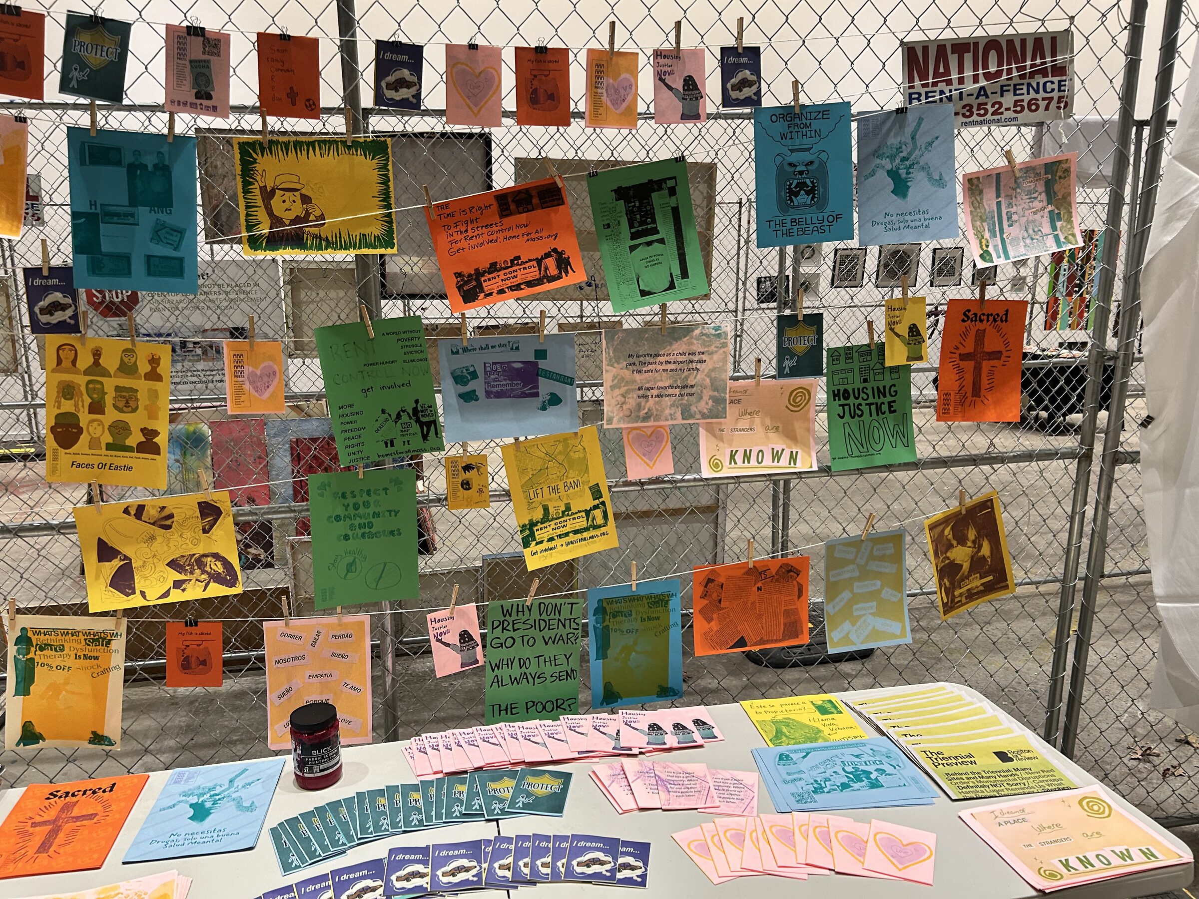Printed flyers and publications on the ñ press table